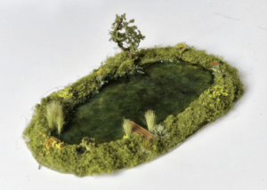 Ready made and painted, model railway pond.